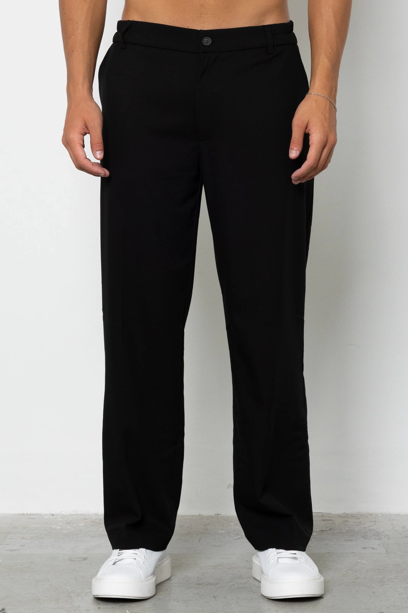 Pantalone con abbottonatura e pences fondo ampio