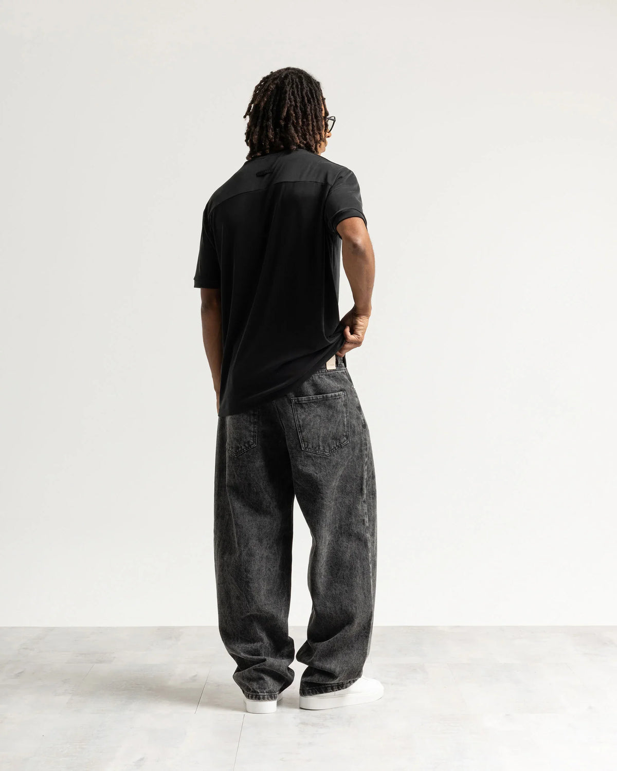 Jeans baggy nero con legature Eternal
